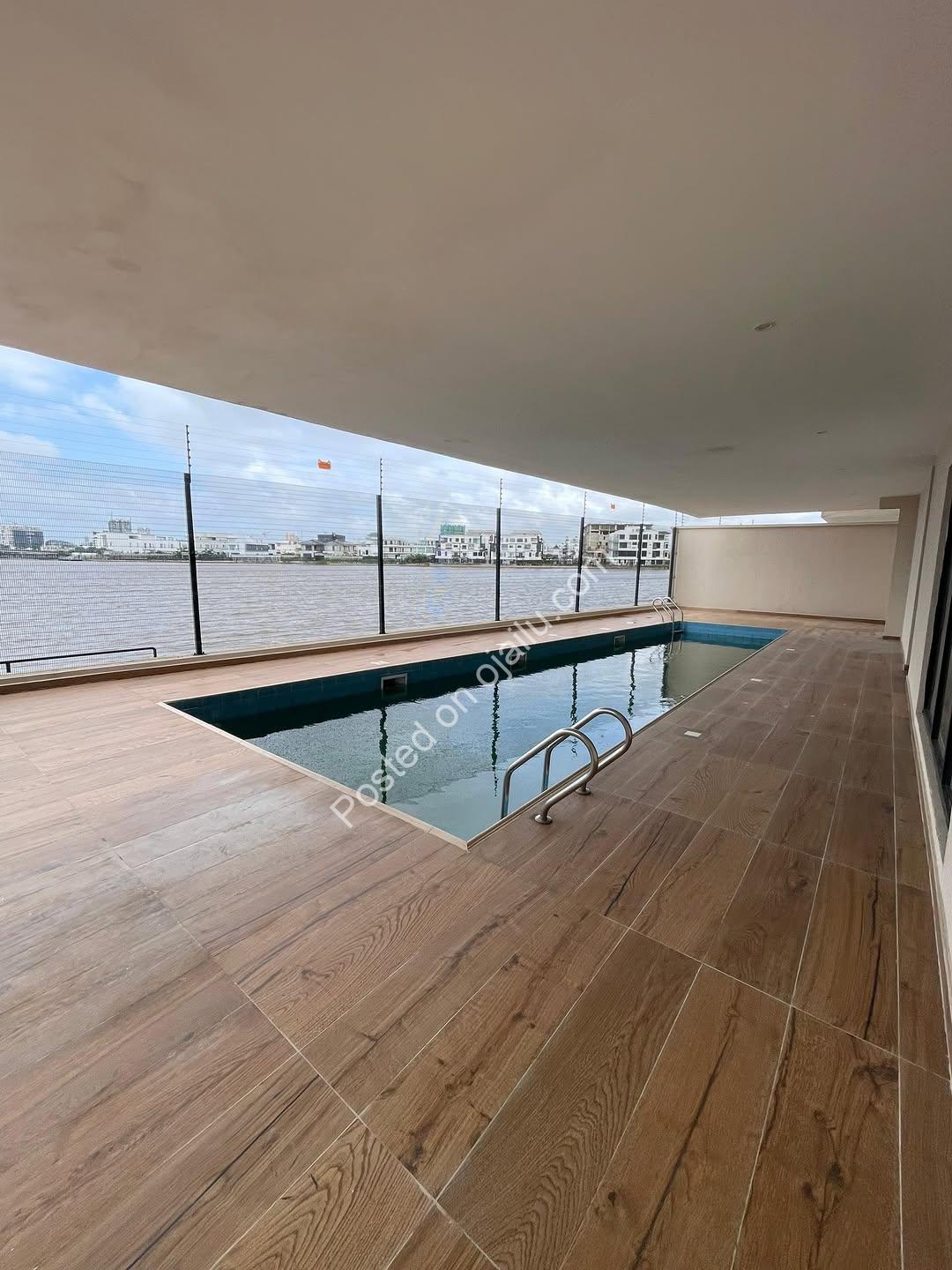 Waterfront Majesty: 5-Bed Ikoyi Palace with Pool & Gym