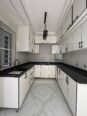 Contemporary 4-Bed Duplex with Walk-In Showers